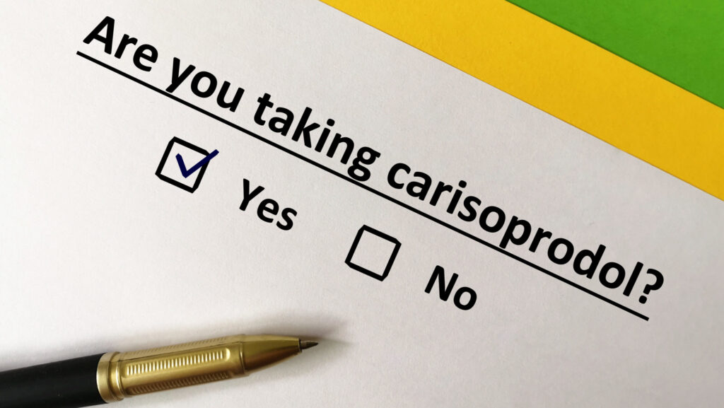 Are you taking carisoprodol is written on a piece of paper with the yes box checked. This represents the raise in muscle relaxant addiction.