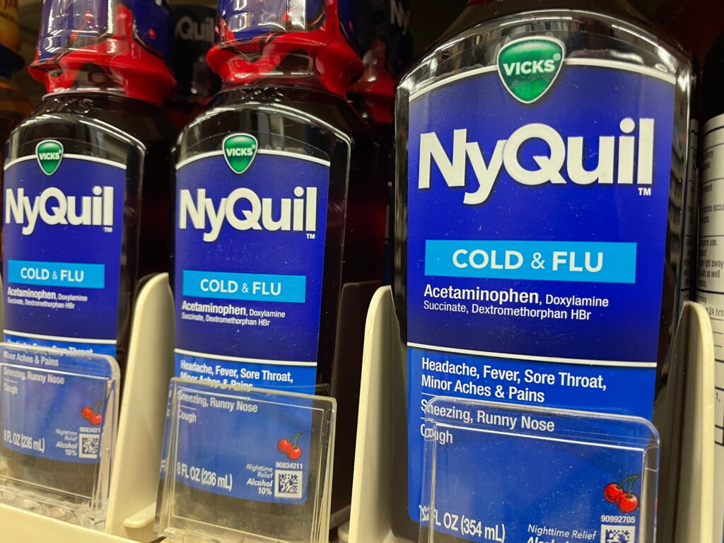 Bottles of NyQuil lined on the drug store shelf begs the question of can you get addicted to NyQuil.