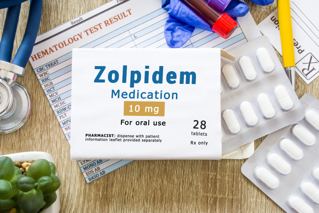 On a desk, a tablet packet of Zolpidem also known by brand name Ambien represents possible Ambien withdrawal symptoms.