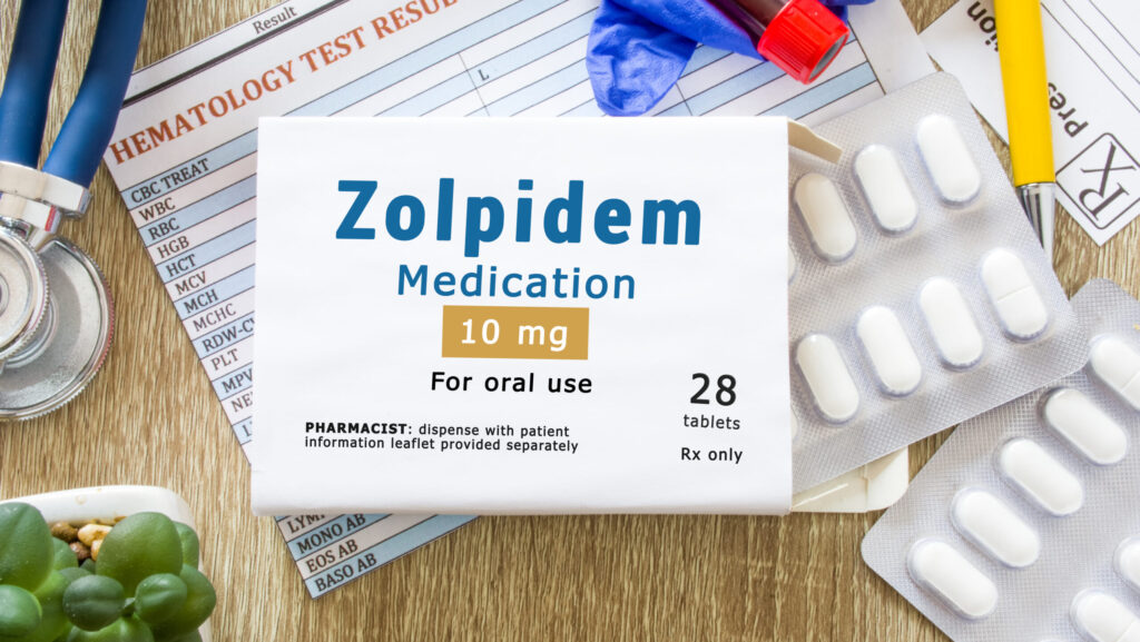 On a desk, a tablet packet of Zolpidem also known by brand name Ambien represents possible Ambien withdrawal symptoms.