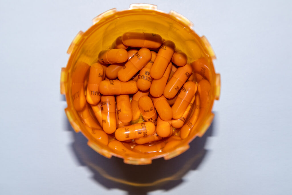 Inside the orange pharmacy bottle of Adderall XR represents its popularity for treating ADHD and how it differs from Dexedrine.